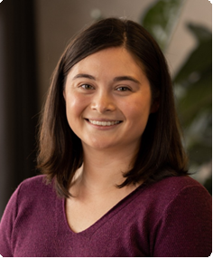 A headshot of a woman in a corporate setting 